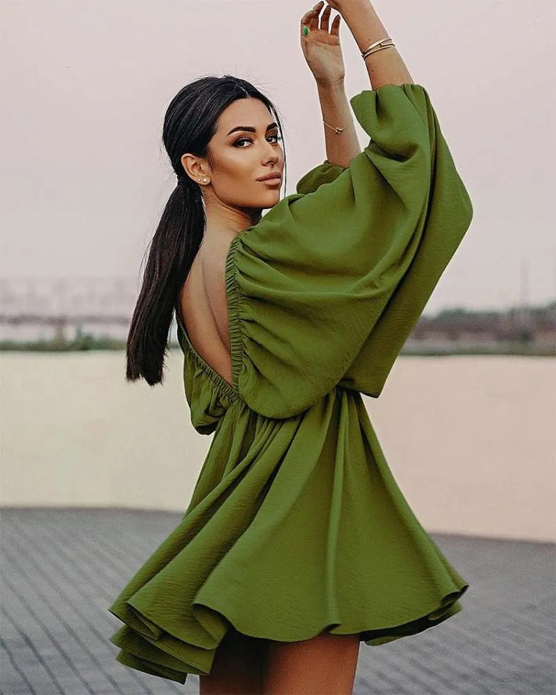 Jurk met wijde mouwen en diepe V-hals - Bakkermode.nl