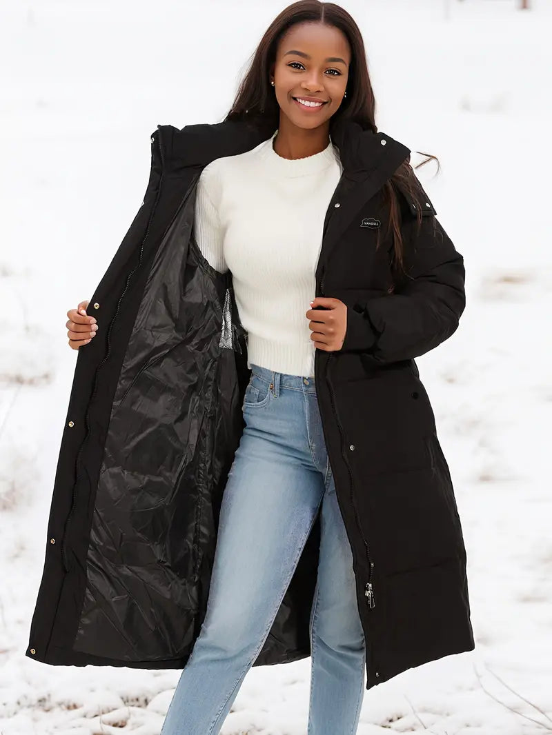 Zwarte lange winterjas met capuchon voor dames – isolerend en comfortabel - Bakkermode.nl
