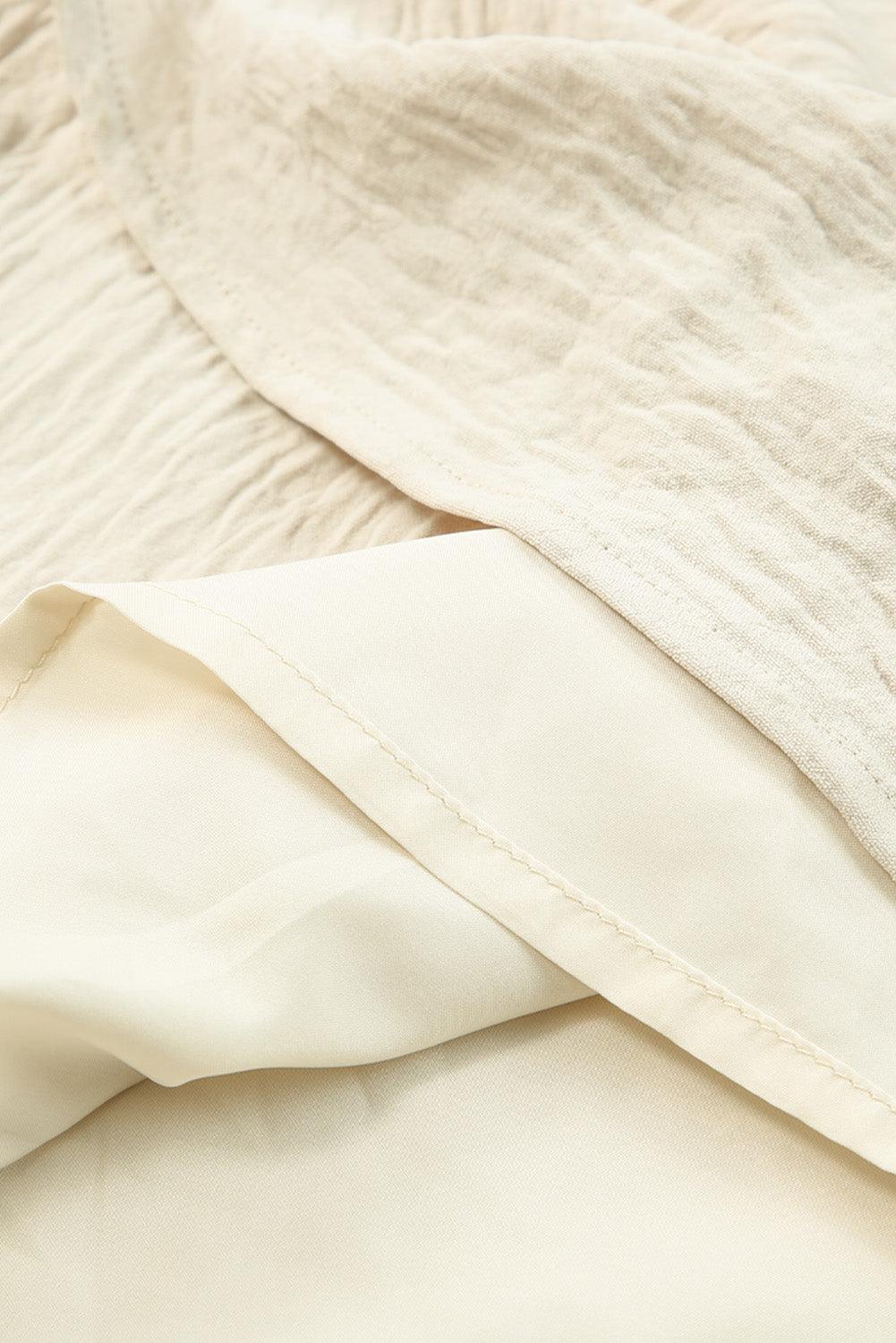 Maxi jurk - elegante beige damesjurk met ceintuur