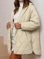 Gewatteerde puffer zwarte en beige winterjas voor dames - warm en oversized - Bakkermode.nl