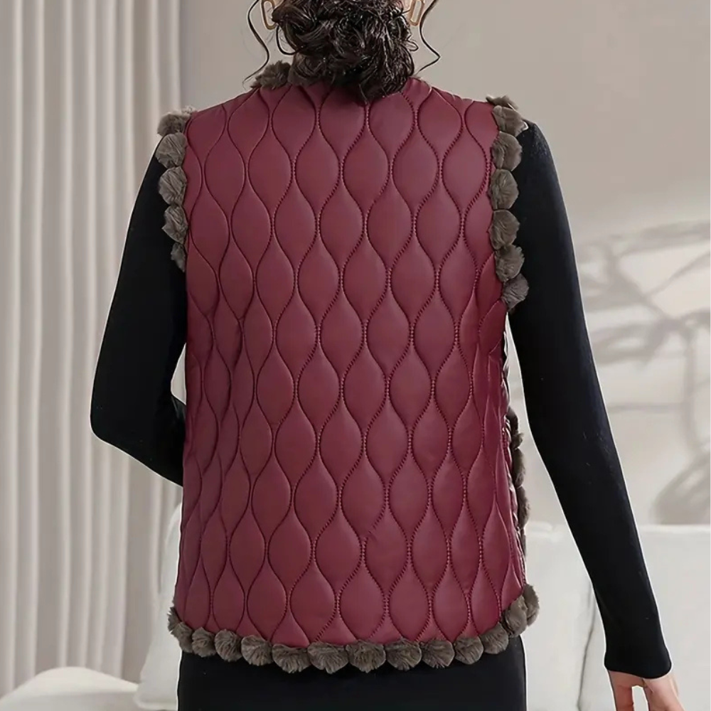 Gequiltte vest - stijlvolle gewatteerde damesgilet met pomponrand