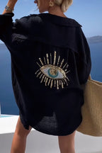 Vrouwelijke strandcover-up van lichtgewicht met oogmotief - trendy zomer shirtjurk voor relaxen bij het zwembad