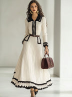 Gebreide midi-jurk - tijdloze damesmode met ceintuur