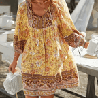 Dames boho mini jurk met v-hals en pofmouwen - relaxed en elegant zomeroutfit